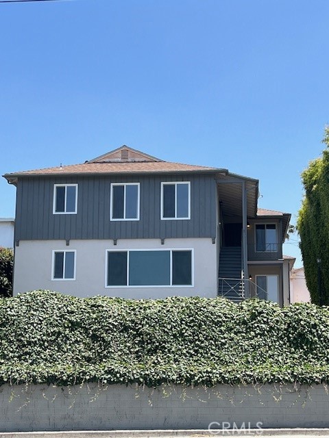 7212 South La Cienega Boulevard Inglewood, CA 90302 - Photo 1 of 8 front view of a house with a yard
