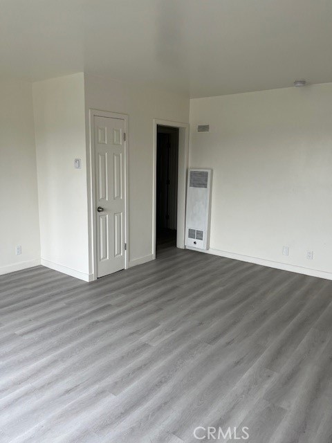 7212 South La Cienega Boulevard Inglewood, CA 90302 - Photo 3 of 8 a view of an empty room and wooden floor