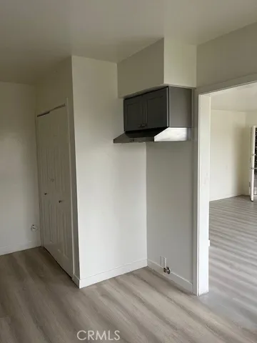 a view of a kitchen with wooden floor