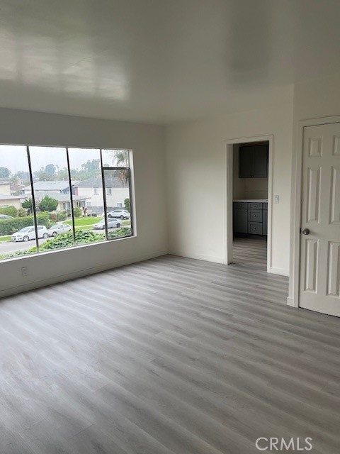7212 South La Cienega Boulevard Inglewood, CA 90302 - Photo 6 of 8 wooden floor in an empty room with a window