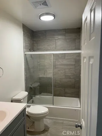 a bathroom with a bathtub and a toilet