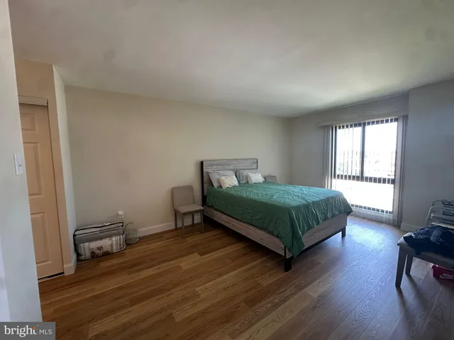 a bedroom with a bed and a chair