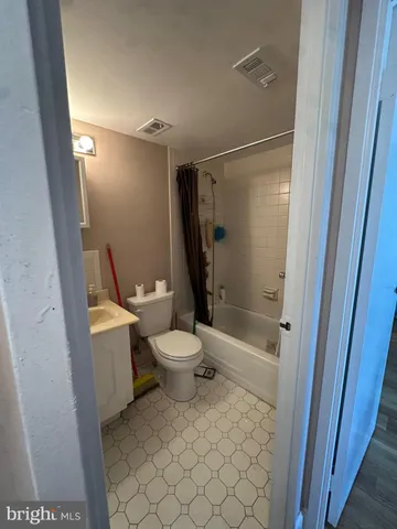 a kitchen with stainless steel appliances a stove a microwave and a refrigerator