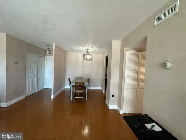 a bedroom with a bed and windows