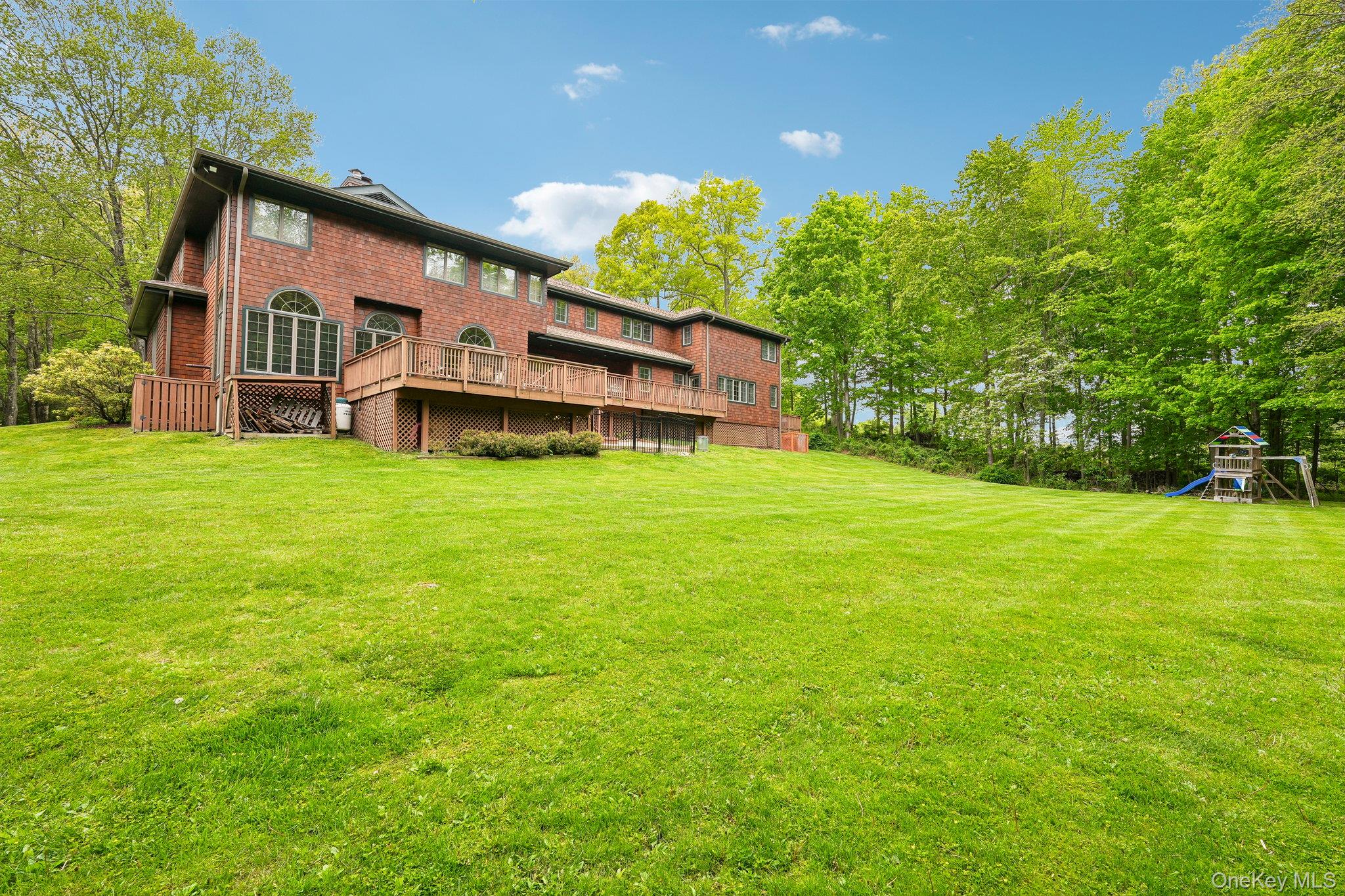 27 Cat Ridge Road North Salem, NY 10560 - Photo 44 of 49 a view of a house with a yard