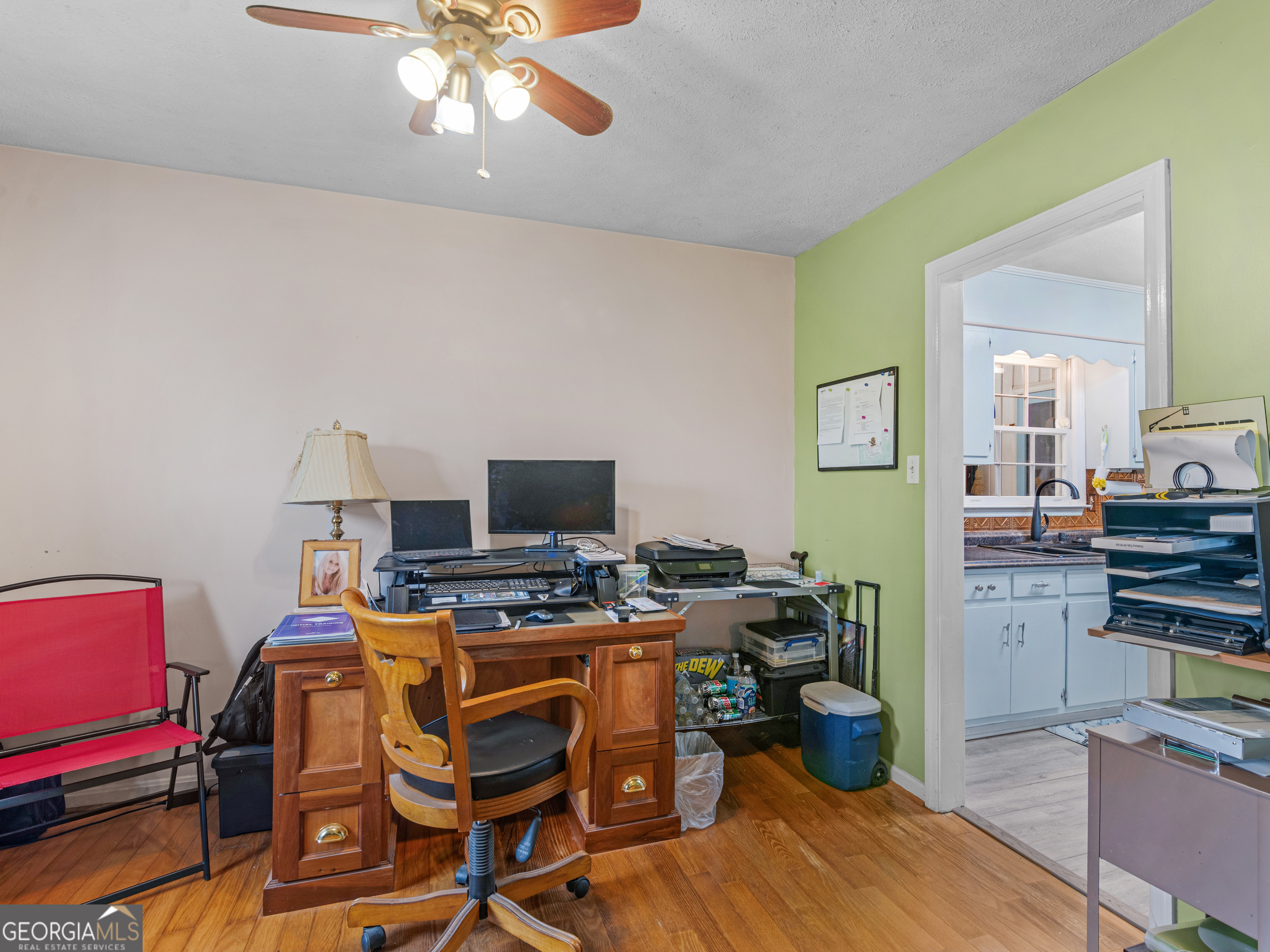 329 Pine Street Barnesville, GA 30204 - Photo 13 of 57 a view of a workspace with furniture and a flat screen tv