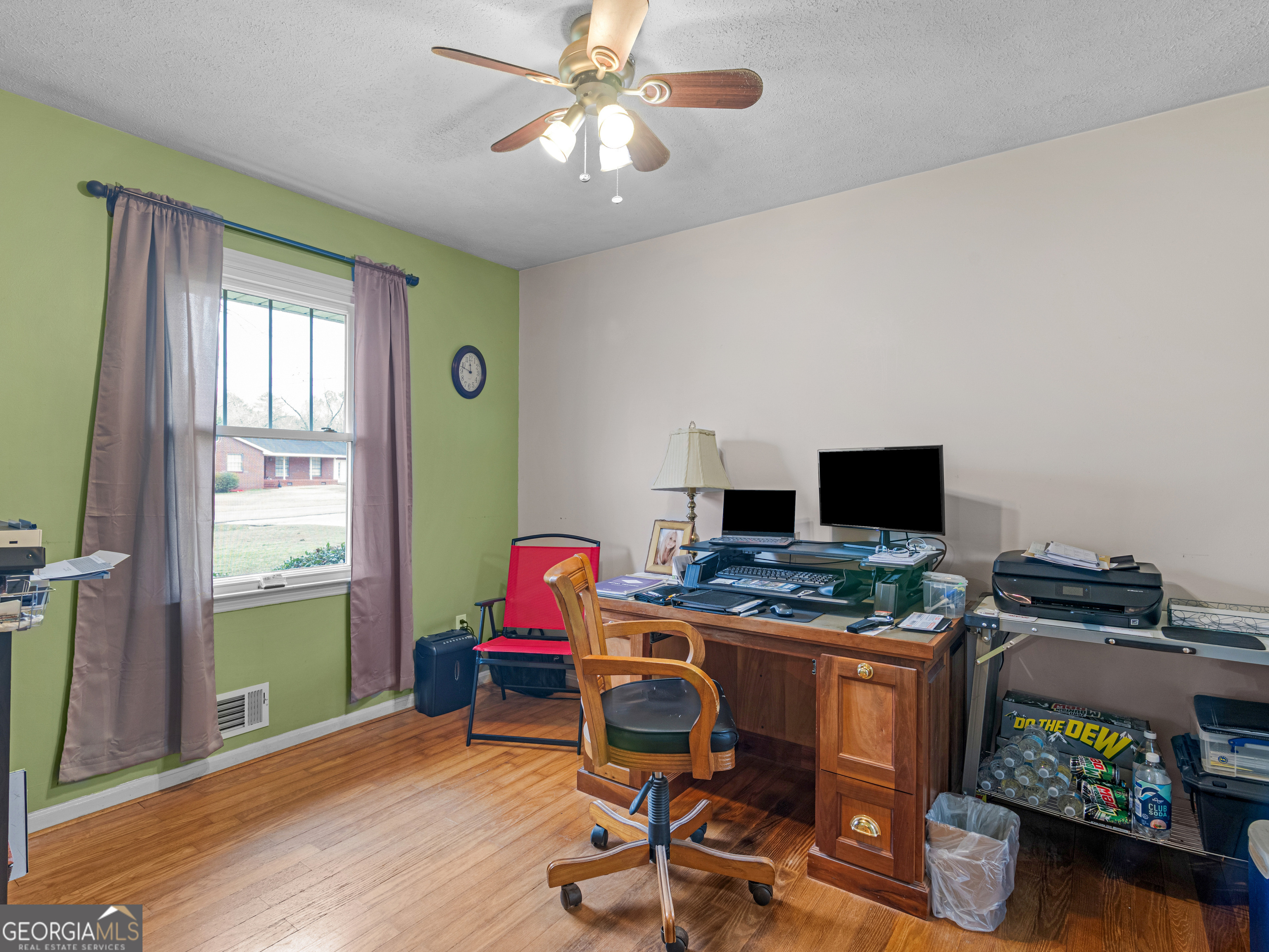 329 Pine Street Barnesville, GA 30204 - Photo 14 of 57 a view of a workspace with furniture and a window