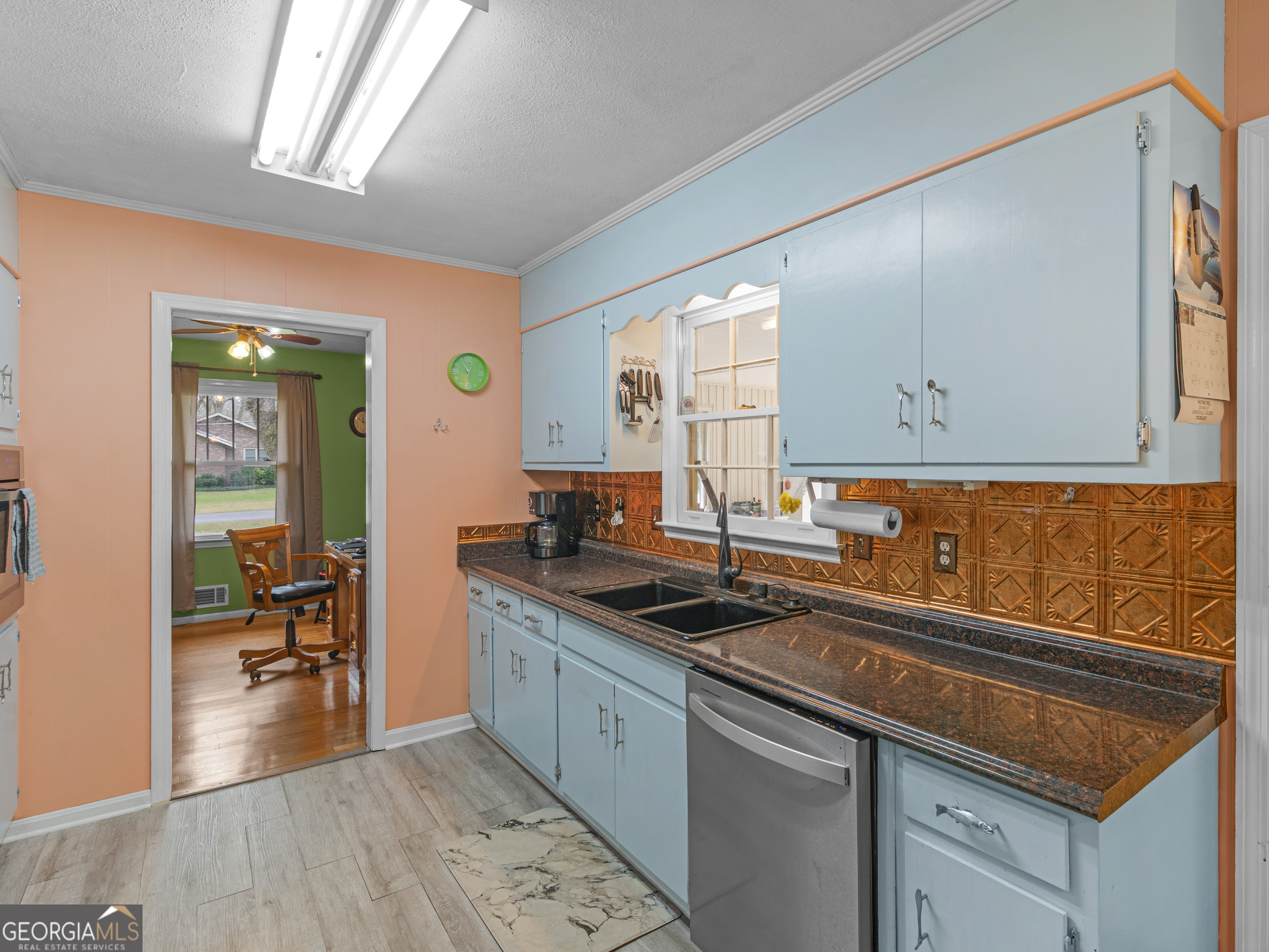 329 Pine Street Barnesville, GA 30204 - Photo 19 of 57 a kitchen with stainless steel appliances granite countertop a sink stove and cabinets