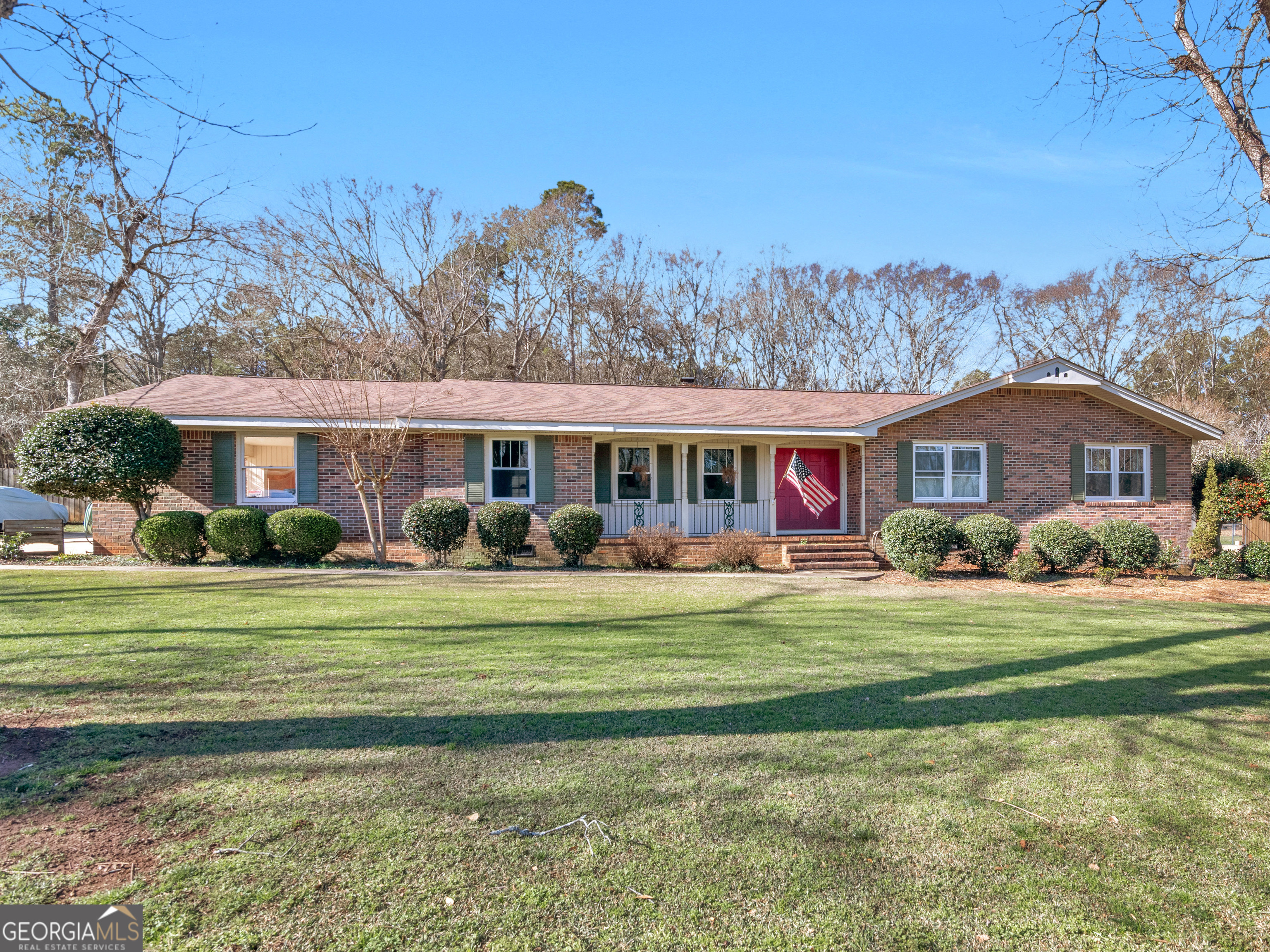 329 Pine Street Barnesville, GA 30204 - Photo 2 of 57 a front view of a house with a garden