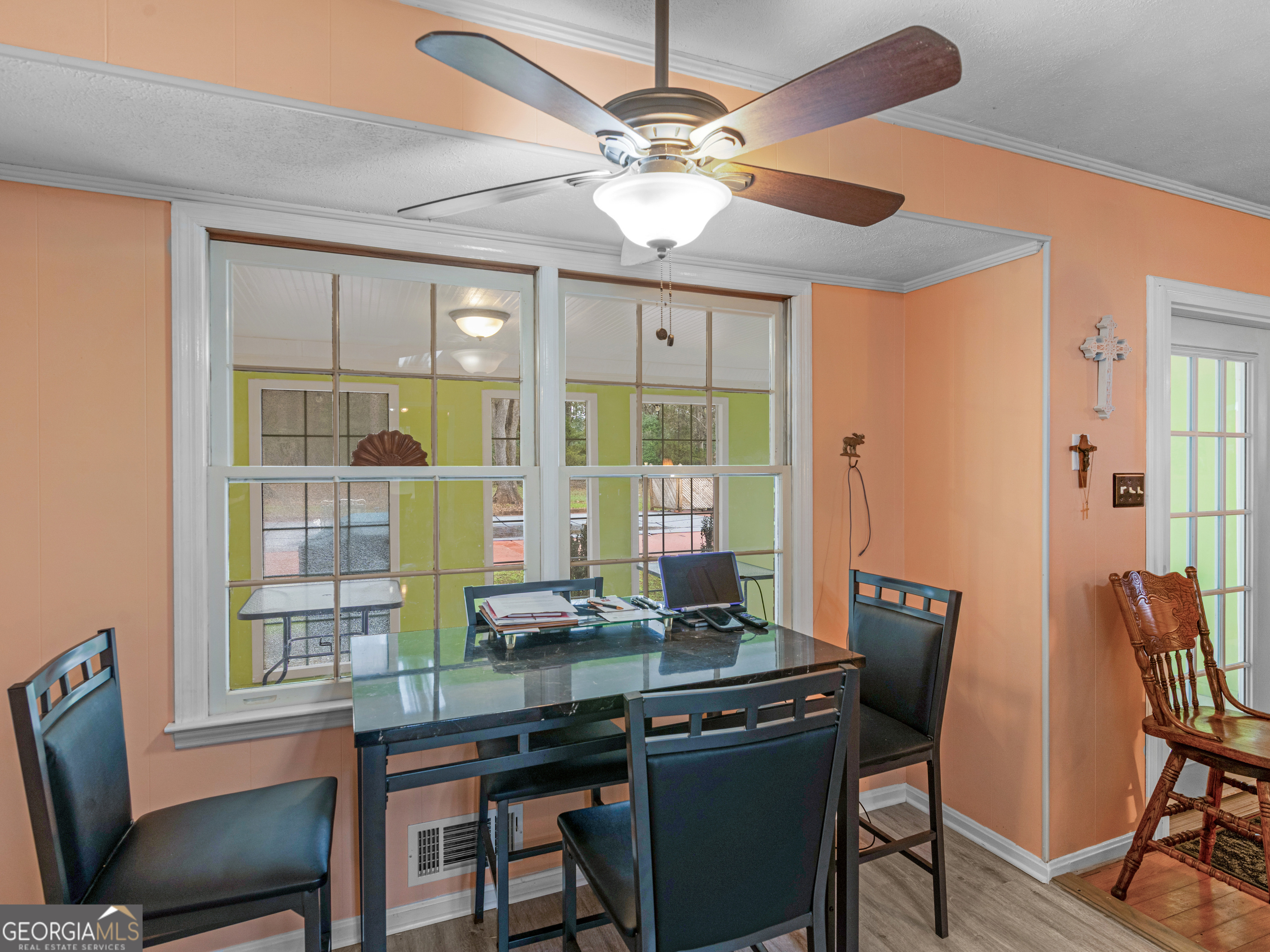 329 Pine Street Barnesville, GA 30204 - Photo 22 of 57 a view of a dining room with furniture window and wooden floor