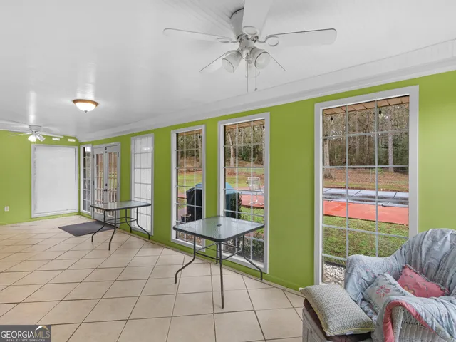a bathroom with a granite countertop toilet a sink and a mirror