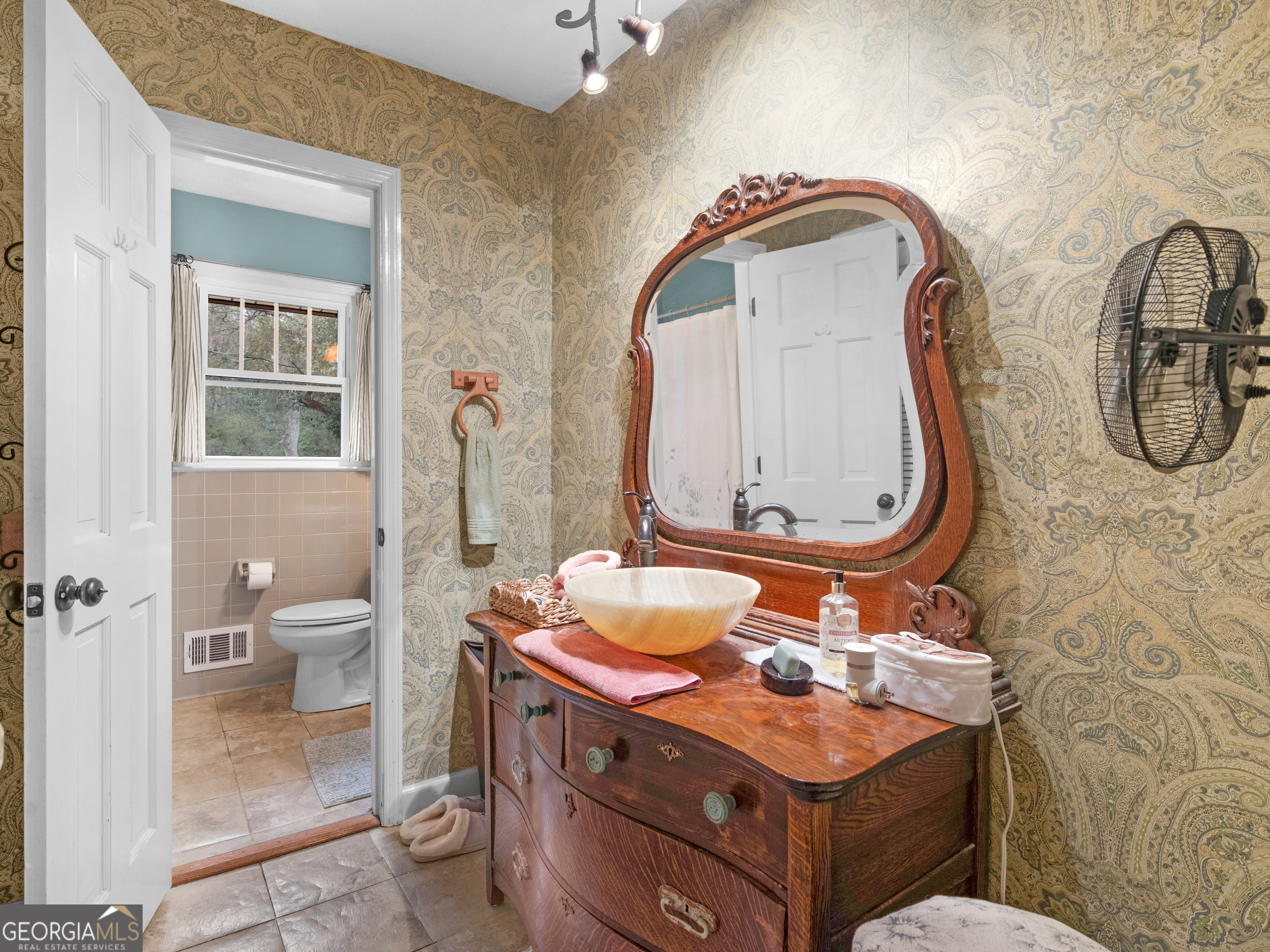 329 Pine Street Barnesville, GA 30204 - Photo 31 of 57 a bathroom with a granite countertop toilet a sink and a mirror