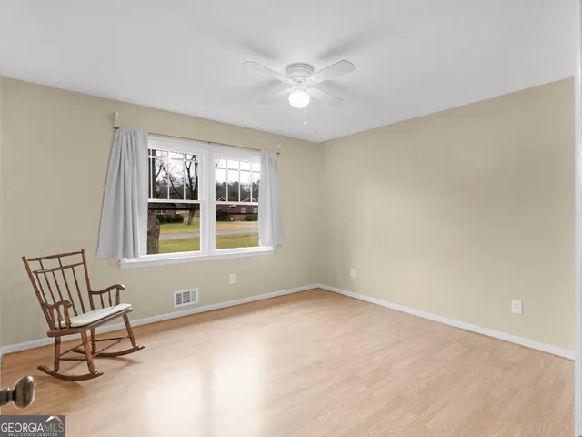 a living room with furniture a rug and a chandelier