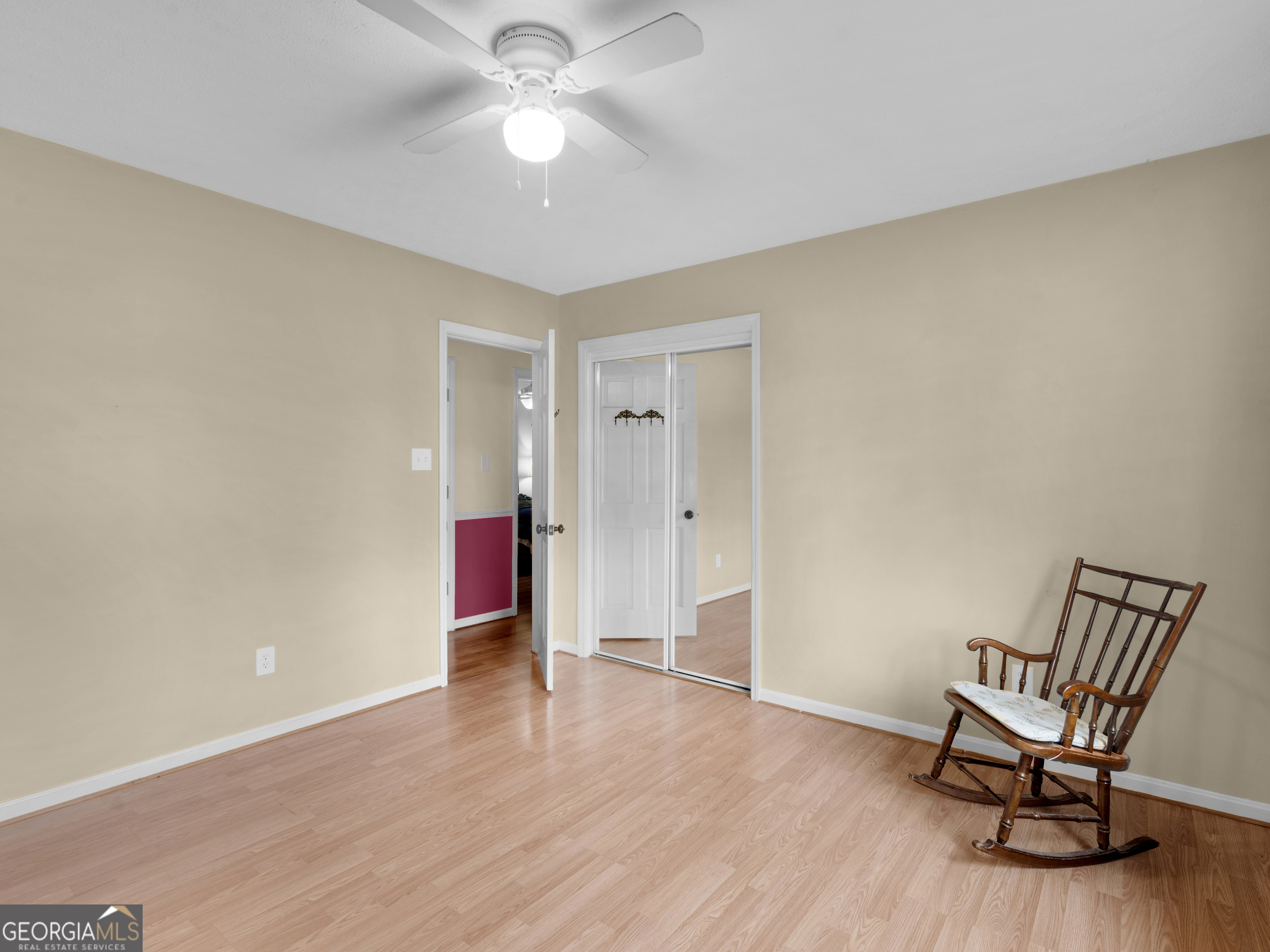 329 Pine Street Barnesville, GA 30204 - Photo 37 of 57 a view of a livingroom with wooden floor and a ceiling fan