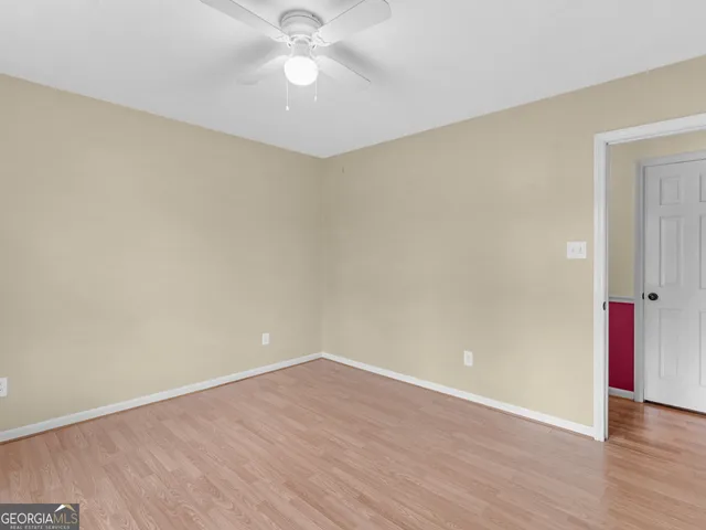 a bed room with a bed and a television