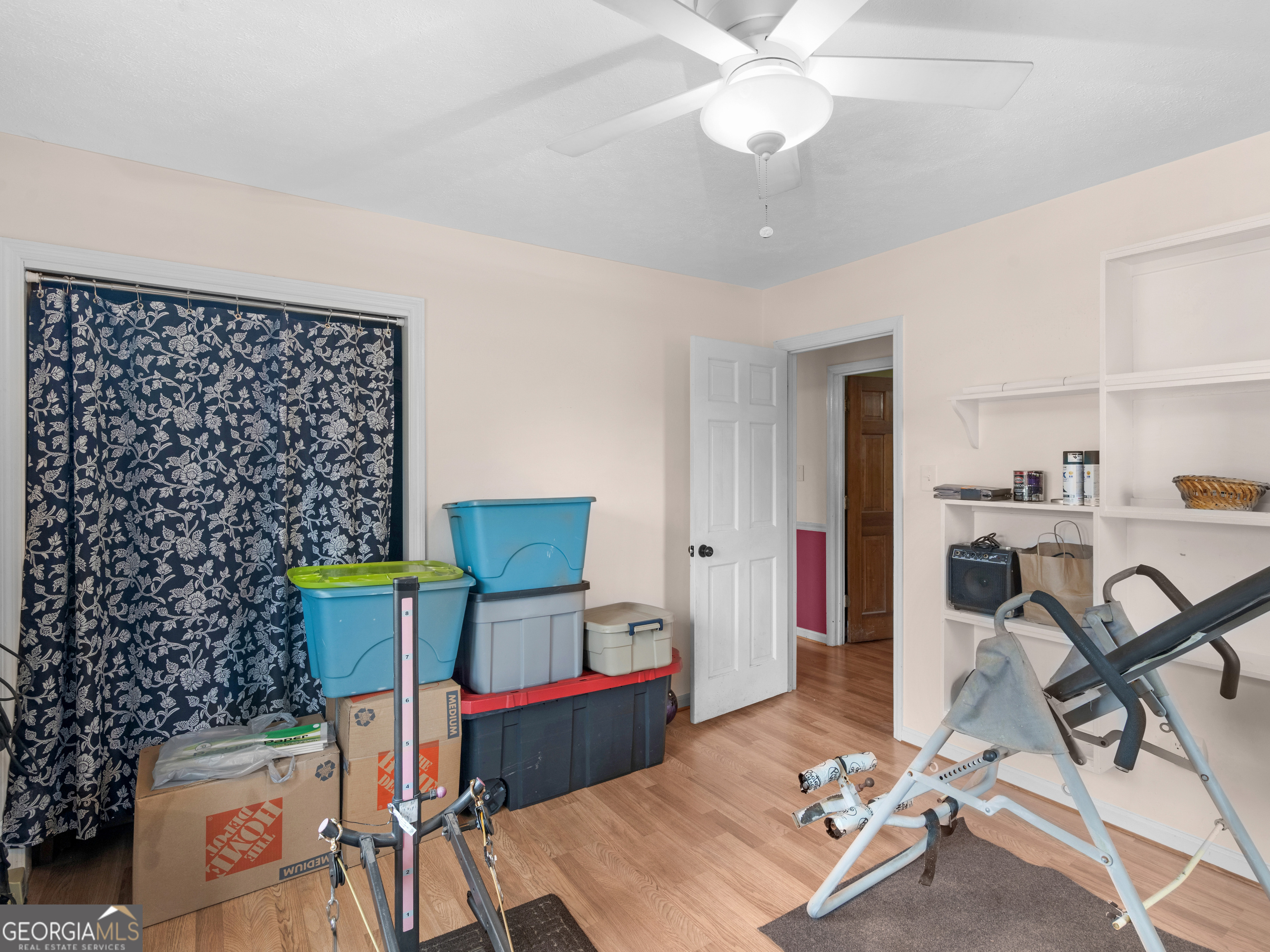 329 Pine Street Barnesville, GA 30204 - Photo 41 of 57 a living room with furniture a rug and a chandelier