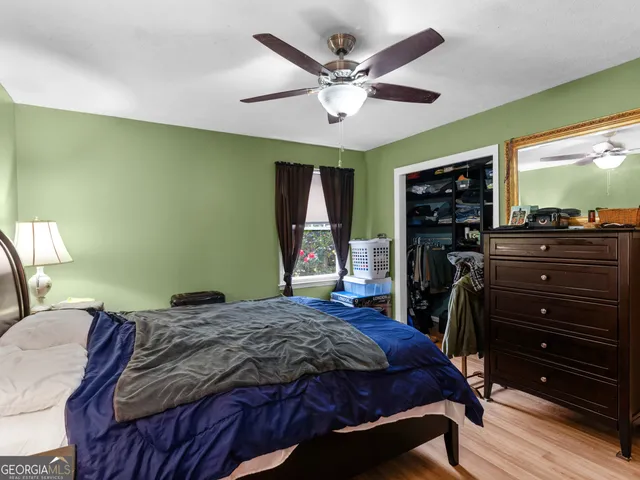 a view of a storage & utility room and bedroom