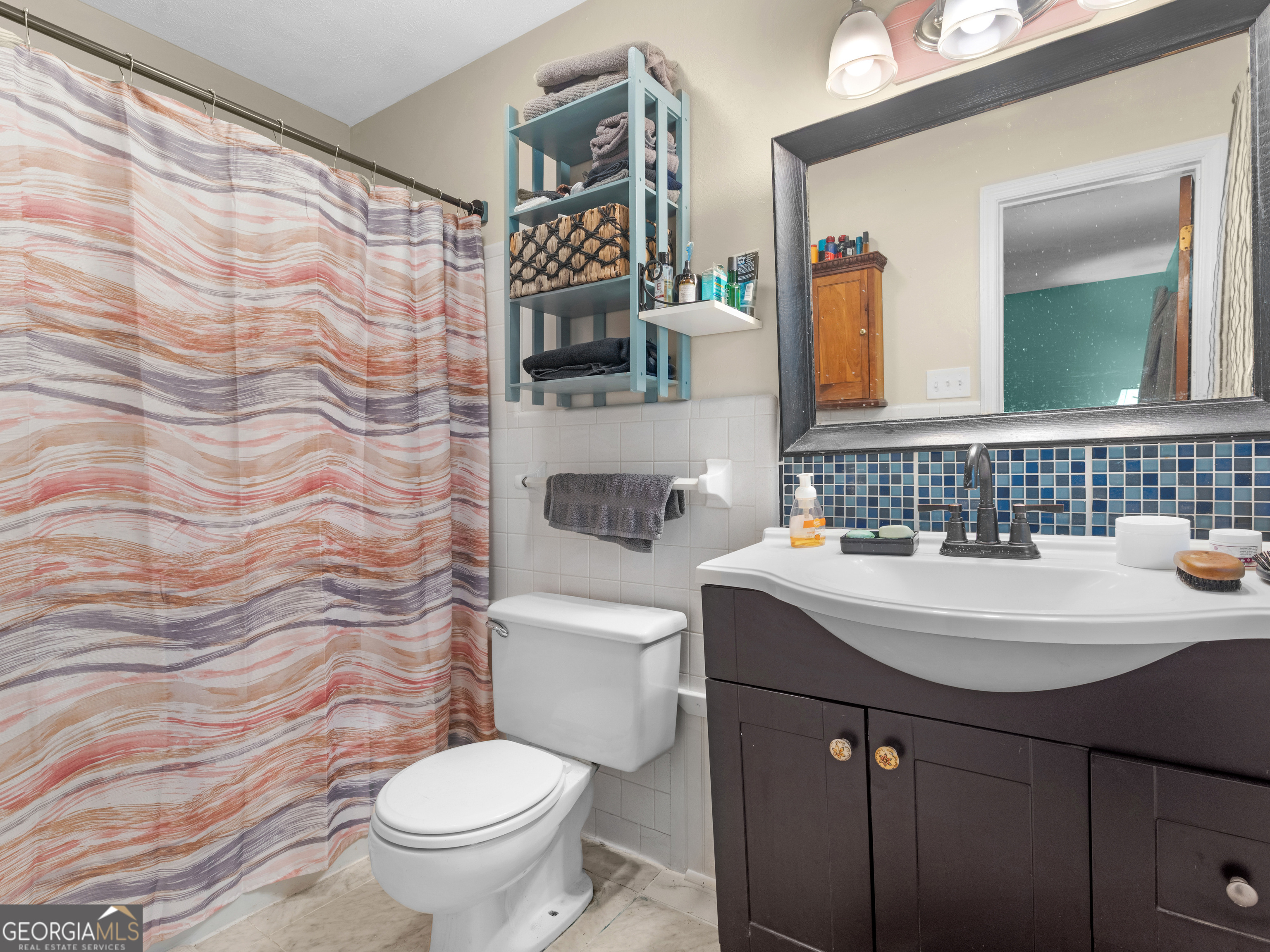 329 Pine Street Barnesville, GA 30204 - Photo 46 of 57 a bathroom with a sink toilet and shower