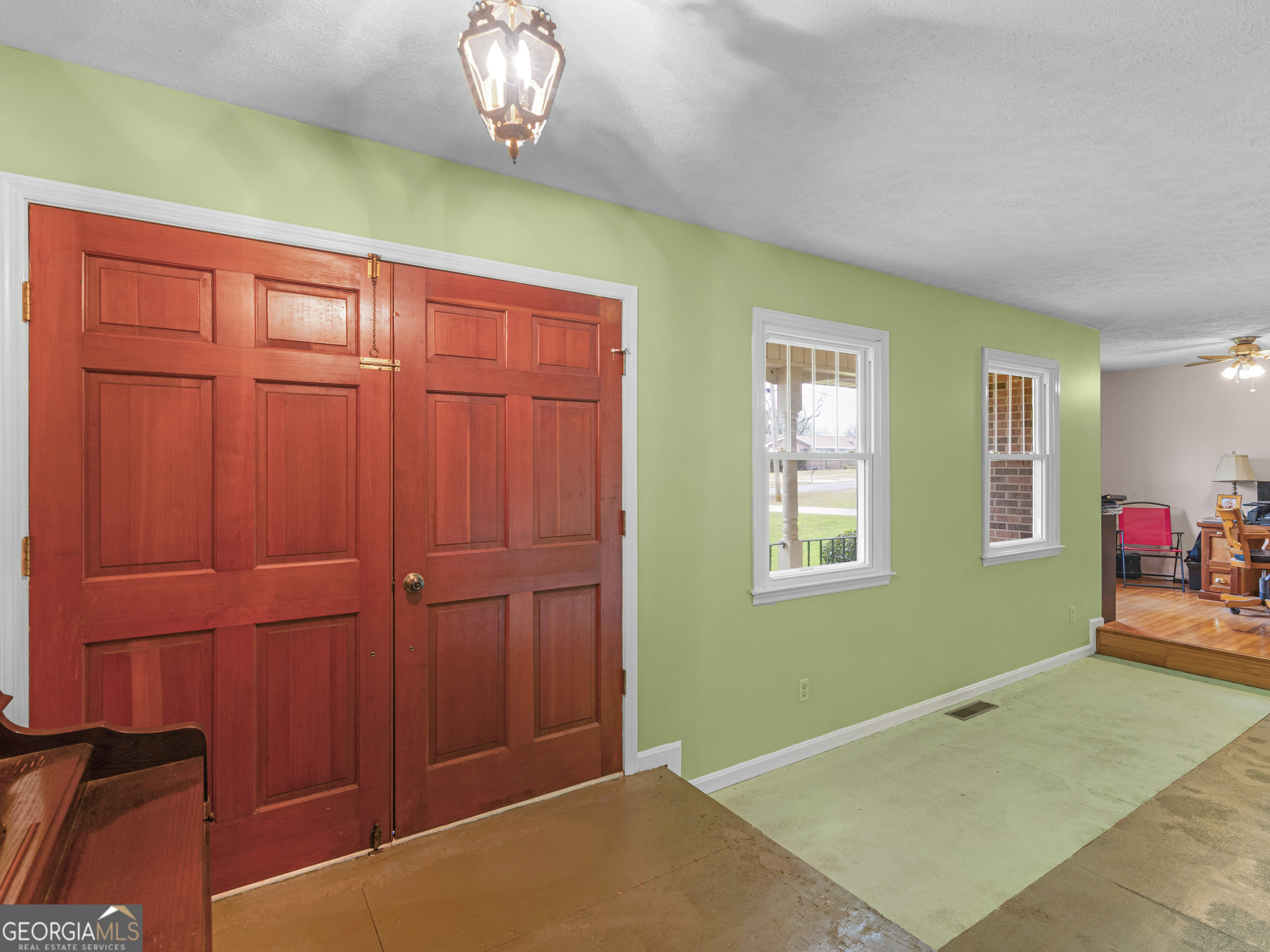 329 Pine Street Barnesville, GA 30204 - Photo 8 of 57 a view of an empty room with a window