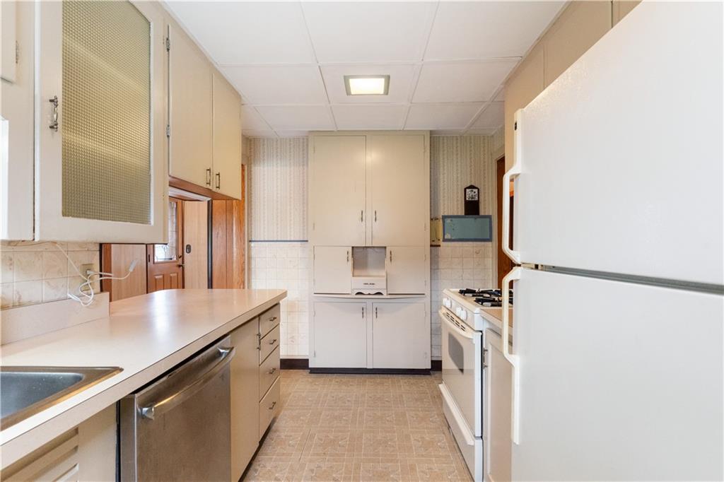 177 Oniontown Road Greenville, PA 16125 - Photo 14 of 18 a kitchen with a sink appliances and cabinets