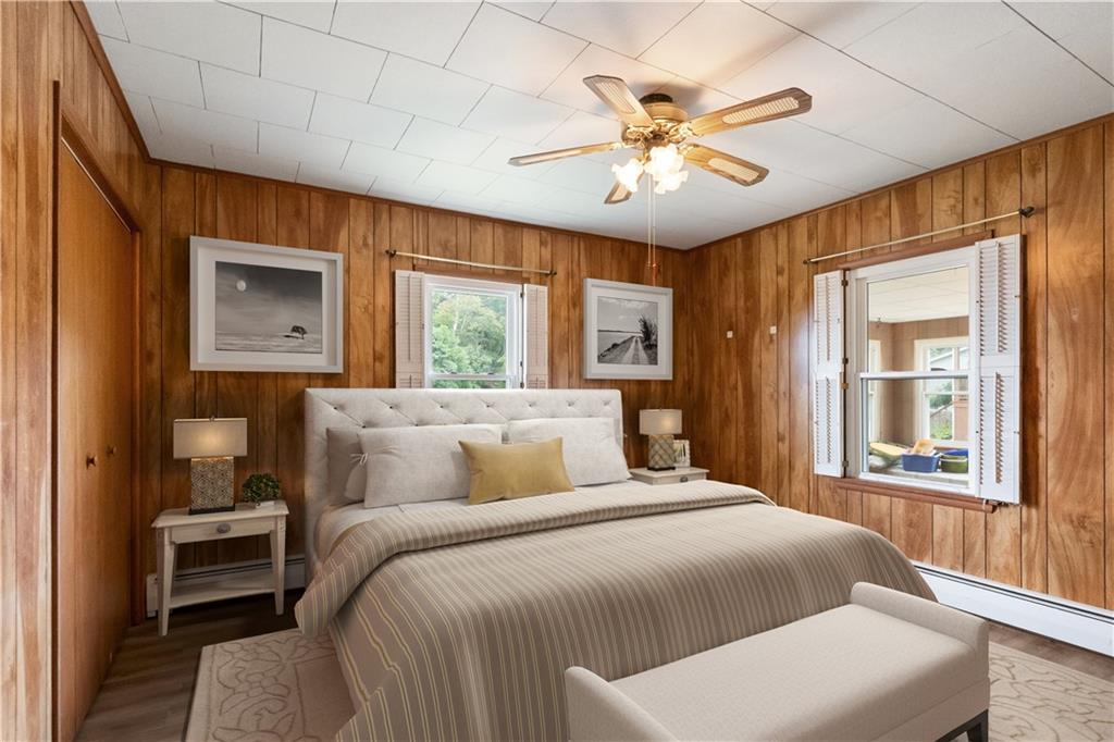 177 Oniontown Road Greenville, PA 16125 - Photo 2 of 18 a bedroom with a large bed and a chandelier