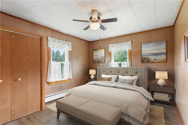 a bedroom with a large bed and a chandelier