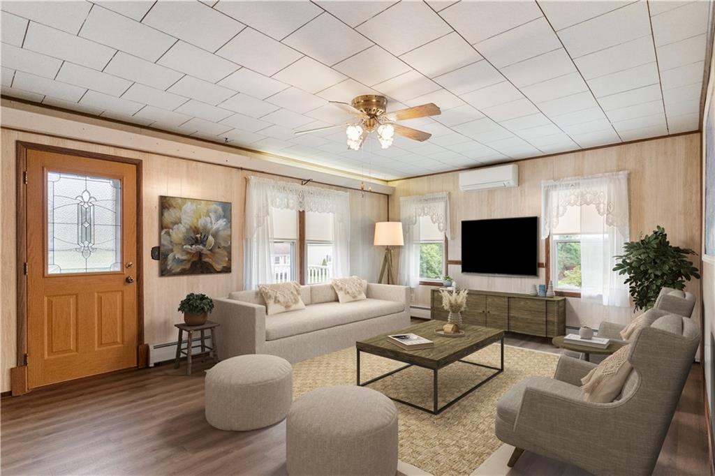 177 Oniontown Road Greenville, PA 16125 - Photo 4 of 18 a living room with furniture and a flat screen tv