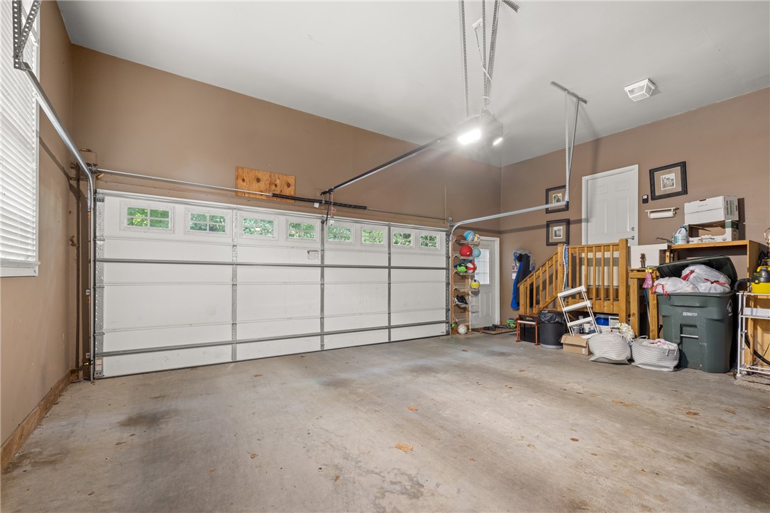 106 Red Maple Way Clemson, SC 29631 - Photo 49 of 49 A spacious garage with a durable concrete floor offers ample room for vehicles and storage.