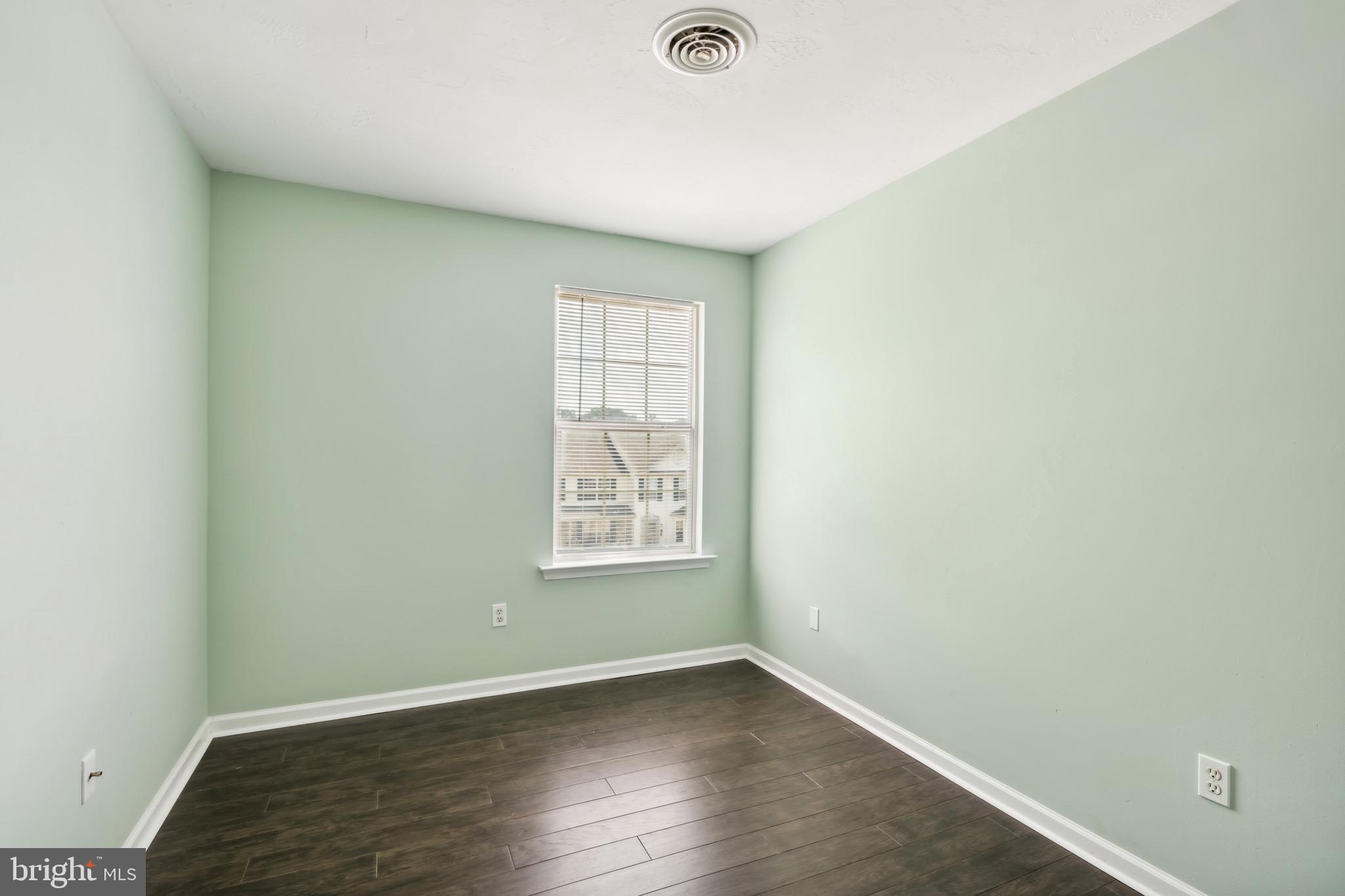 188 Sara Lane Hanover, PA 17331 - Photo 12 of 25 an empty room with wooden floor and windows