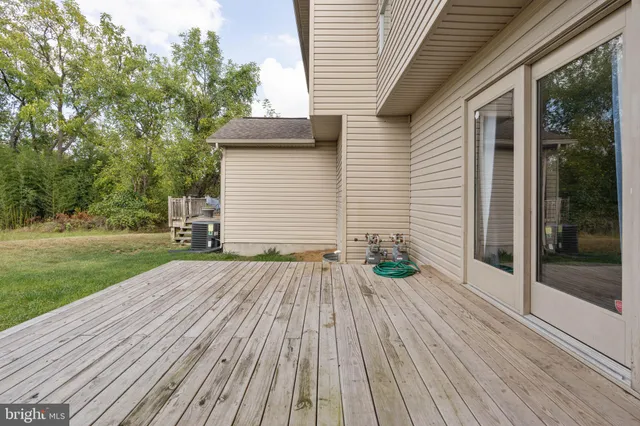 a view of backyard with a deck