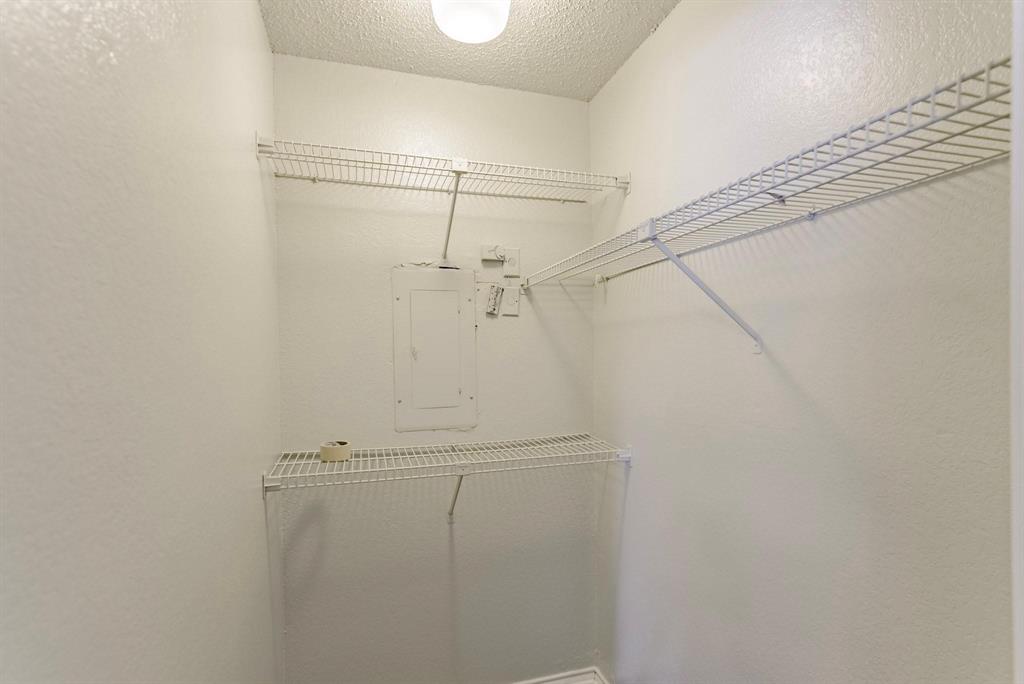 9823 Walnut Street, Unit L205 Dallas, TX 75243 - Photo 9 of 30 Walk in closet for first bedroom