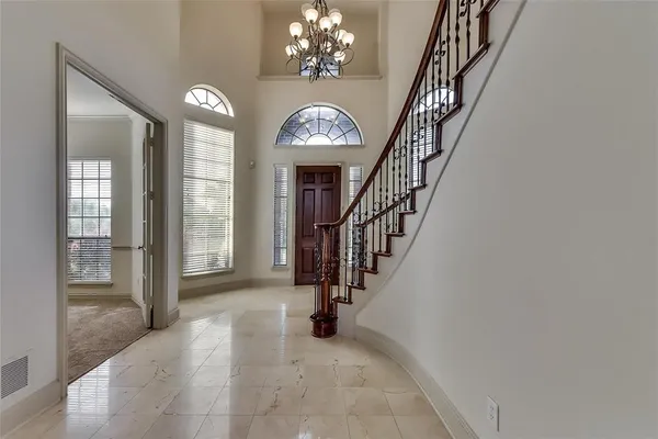 a view of entryway and hall with a front door