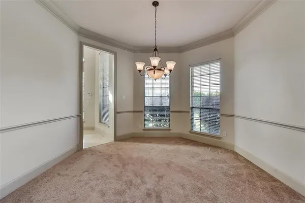 a view of a room with large windows