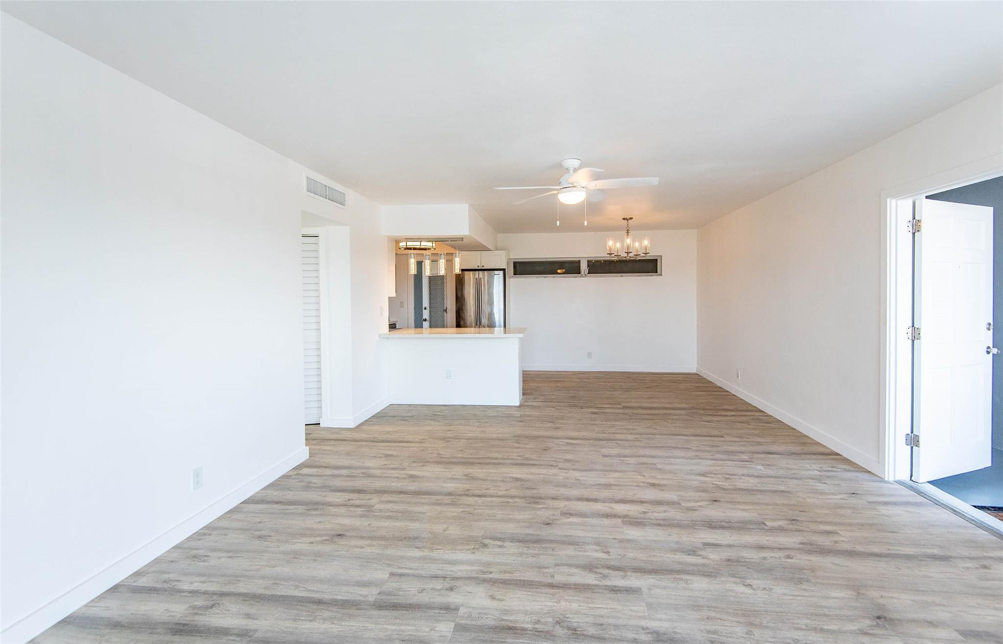 651 Pine Drive, Unit 306 Pompano Beach, FL 33060 - Photo 12 of 36 a view of empty room with wooden floor