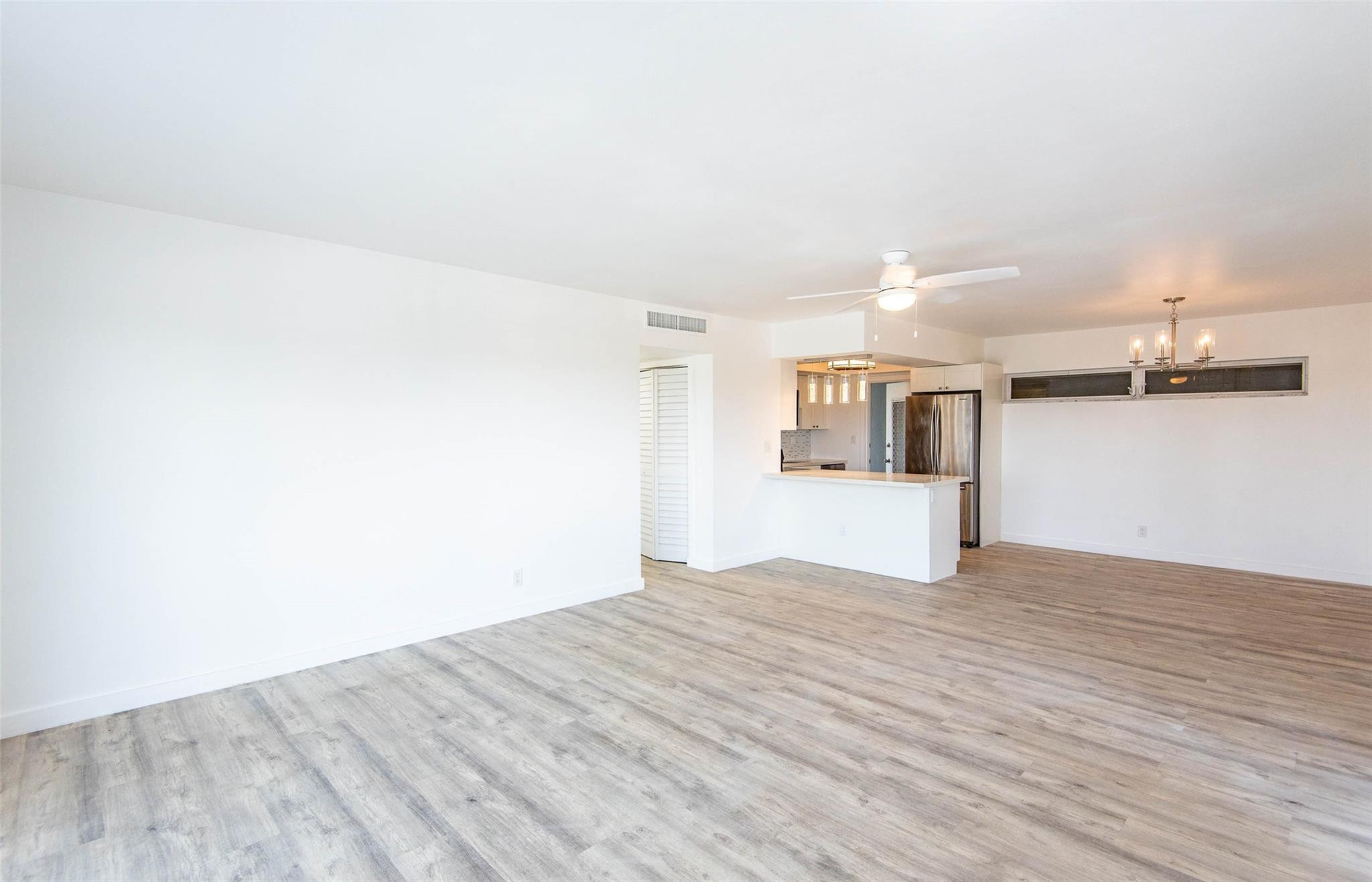 651 Pine Drive, Unit 306 Pompano Beach, FL 33060 - Photo 13 of 36 a view of empty room with wooden floor