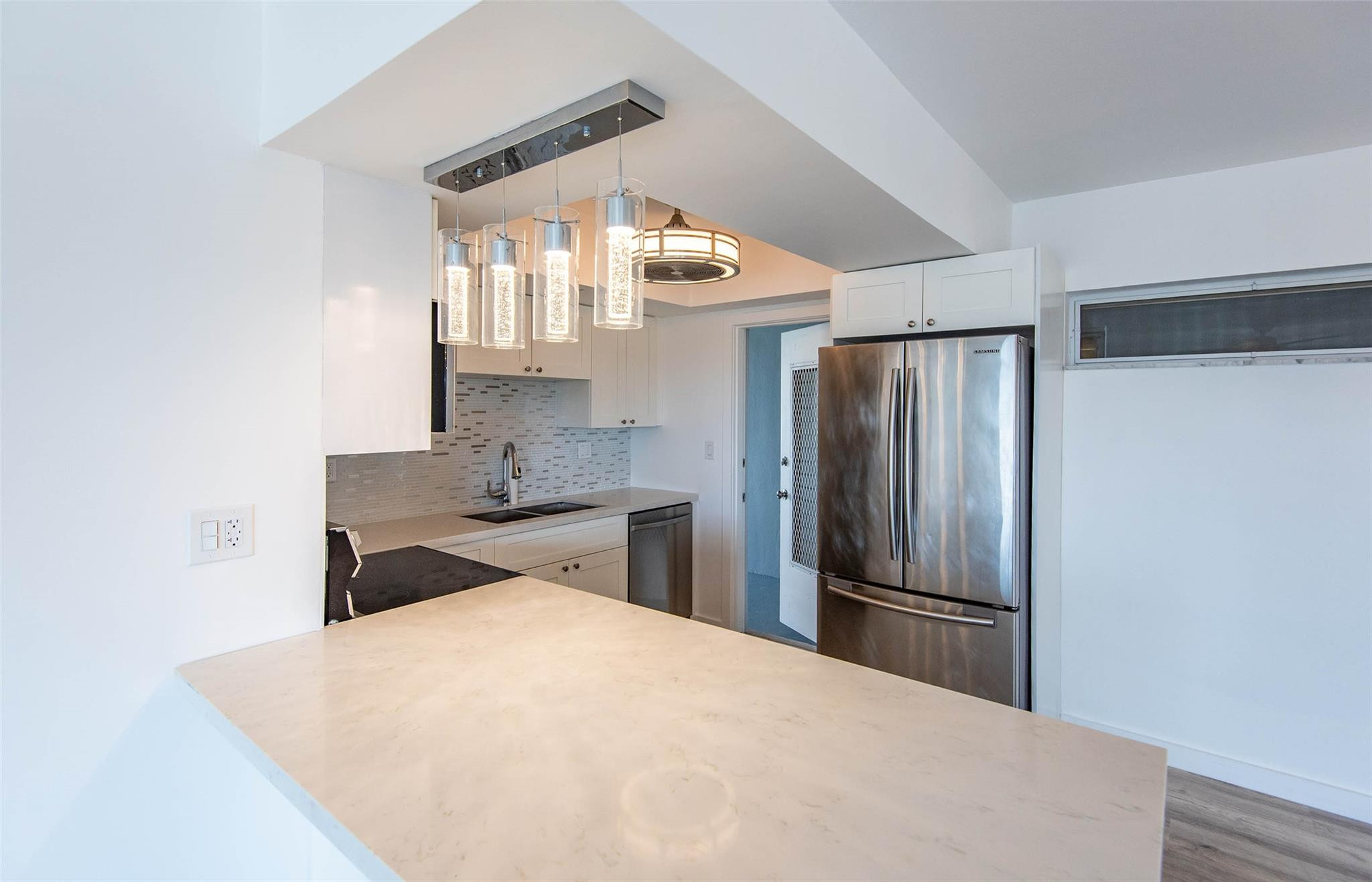 651 Pine Drive, Unit 306 Pompano Beach, FL 33060 - Photo 19 of 36 a kitchen with stainless steel appliances a refrigerator and a stove
