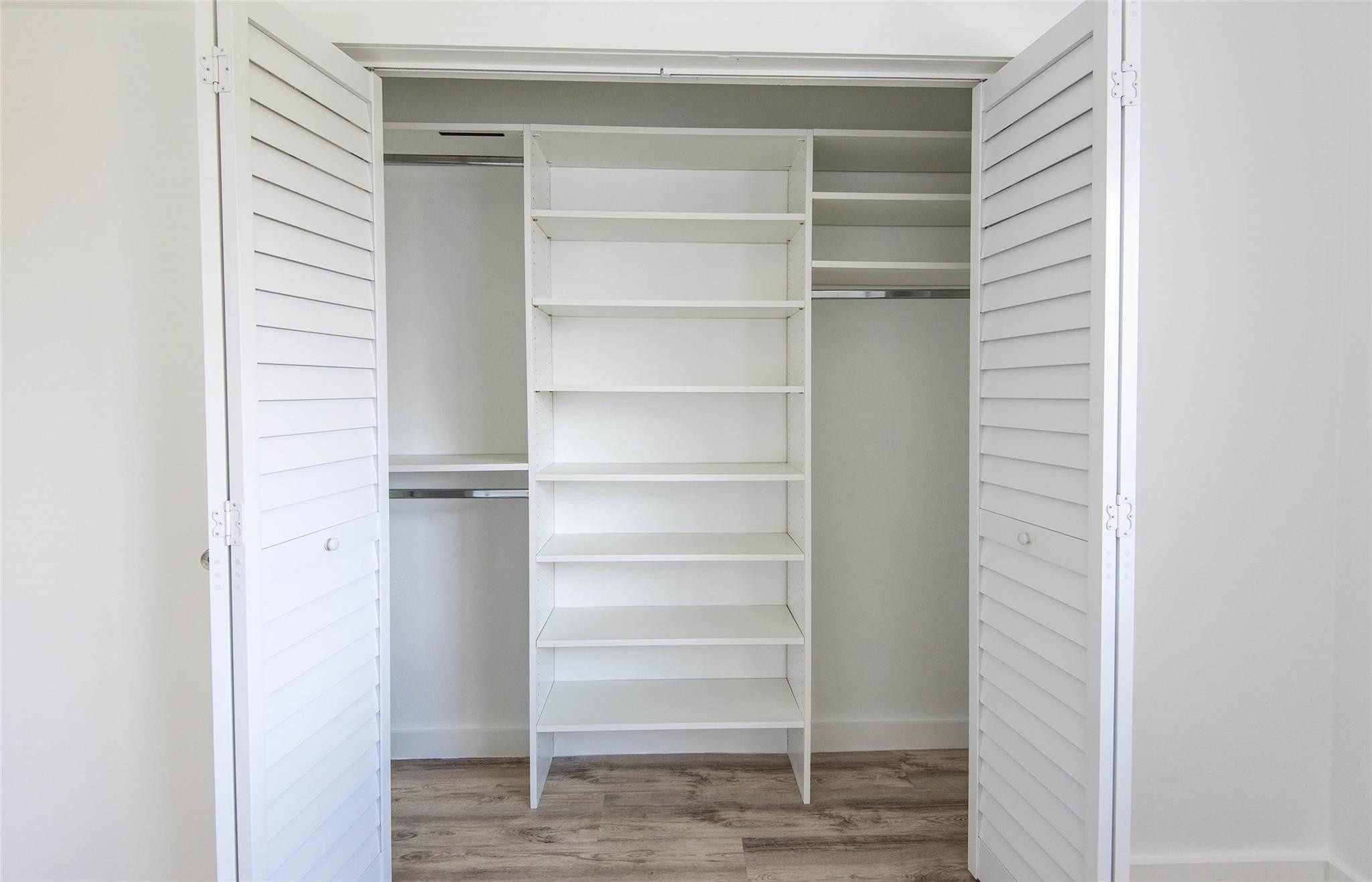 651 Pine Drive, Unit 306 Pompano Beach, FL 33060 - Photo 29 of 36 a view of walk in closet with empty racks