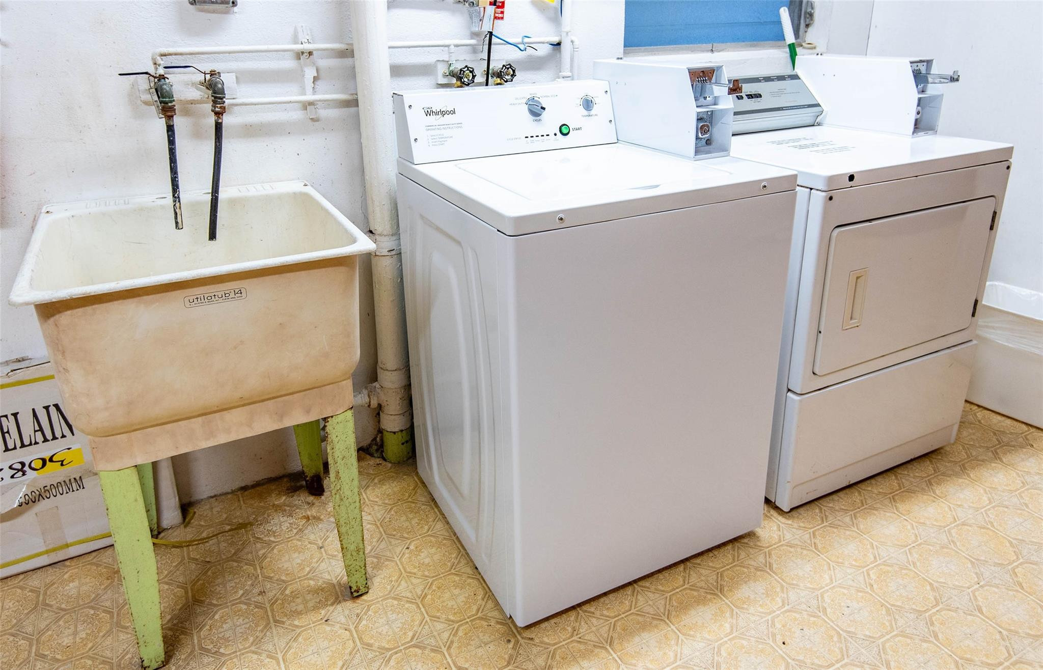 651 Pine Drive, Unit 306 Pompano Beach, FL 33060 - Photo 36 of 36 a utility room with dryer and washer