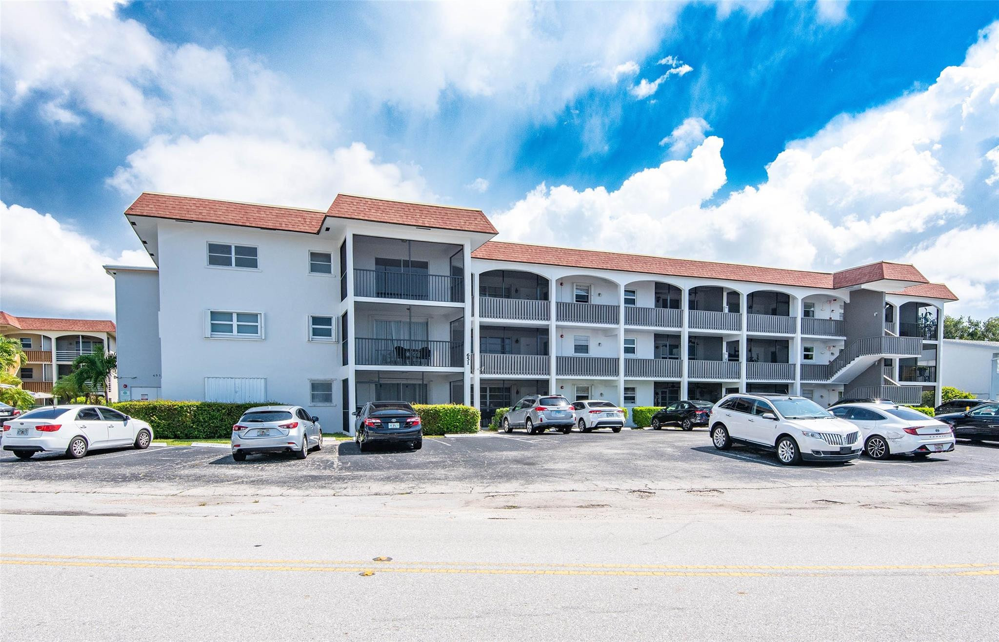 651 Pine Drive, Unit 306 Pompano Beach, FL 33060 - Photo 5 of 36 a car parked in front of a building