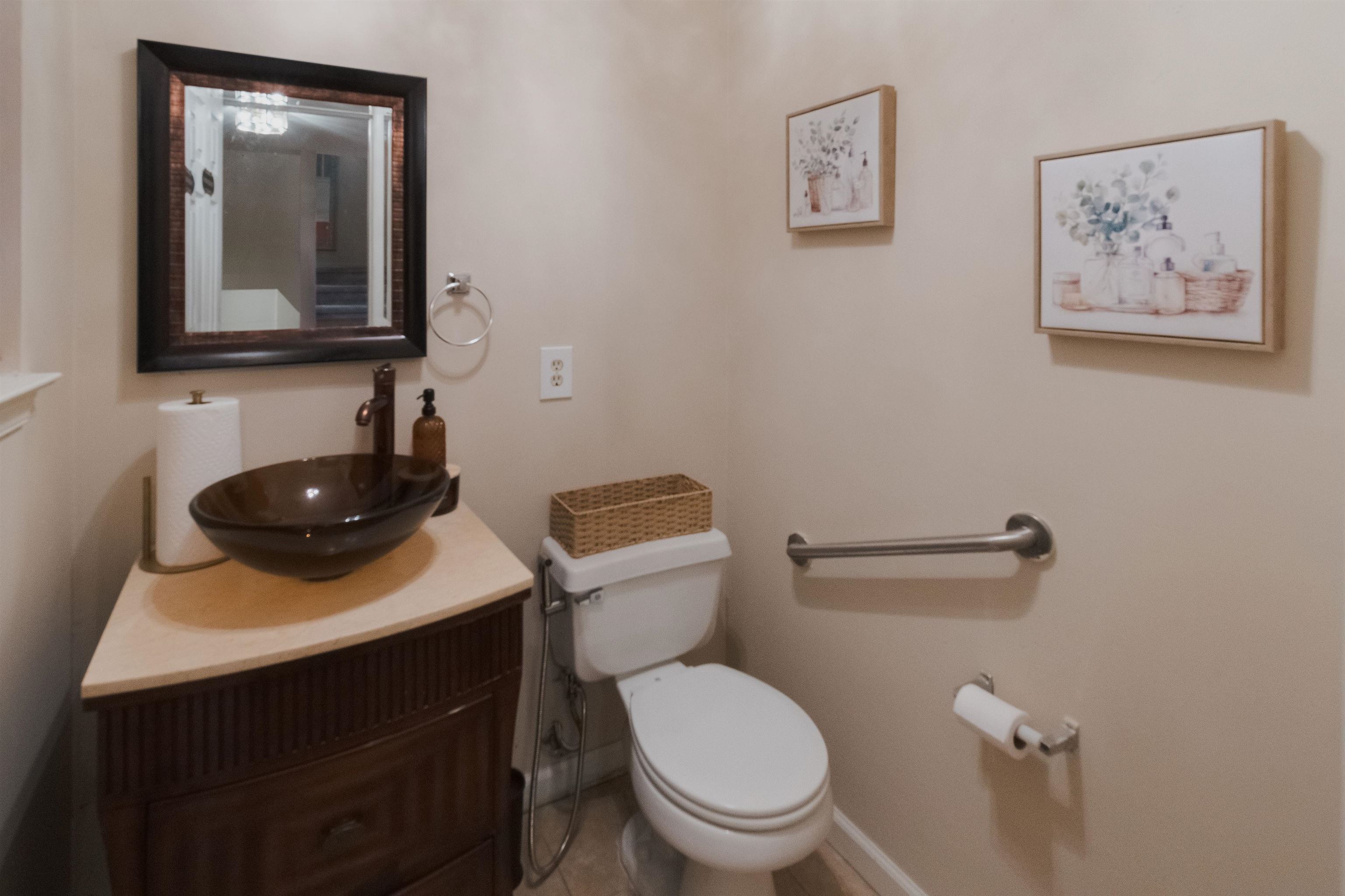 59 Morning Watch Road Wayne, NJ 07470 - Photo 5 of 12 a bathroom with a toilet a sink and mirror