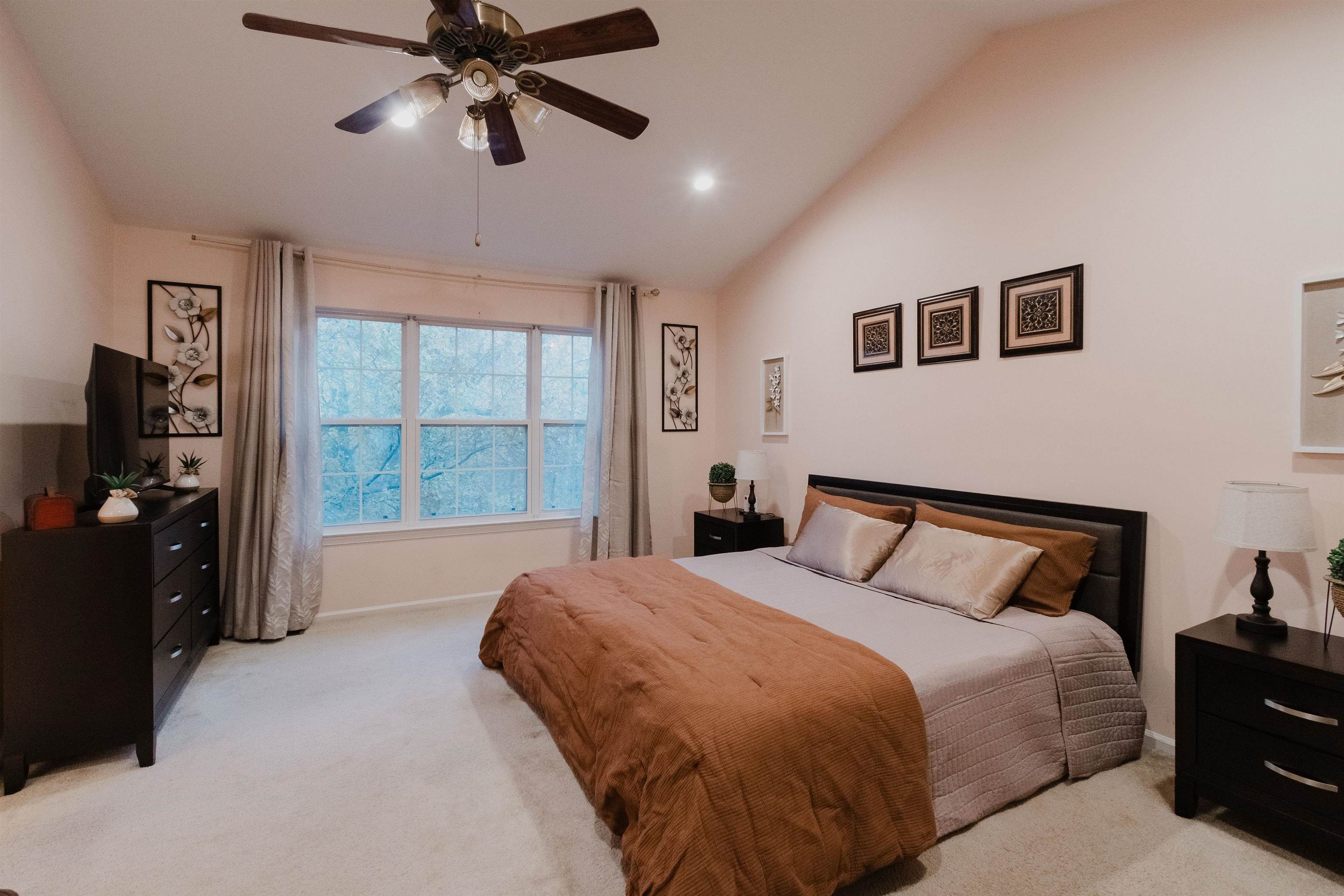 59 Morning Watch Road Wayne, NJ 07470 - Photo 7 of 12 a bedroom with a bed and a chandelier