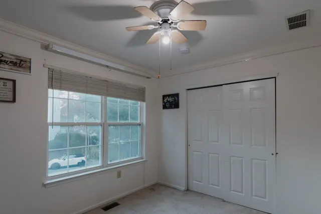 a view of an empty room with a window