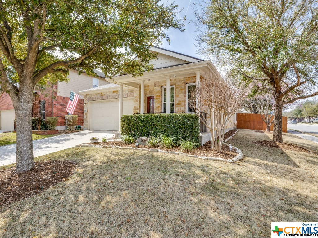 549 Celtic Ash Run Schertz, TX 78108 - Photo 1 of 1 a front view of a house with a yard and garage
