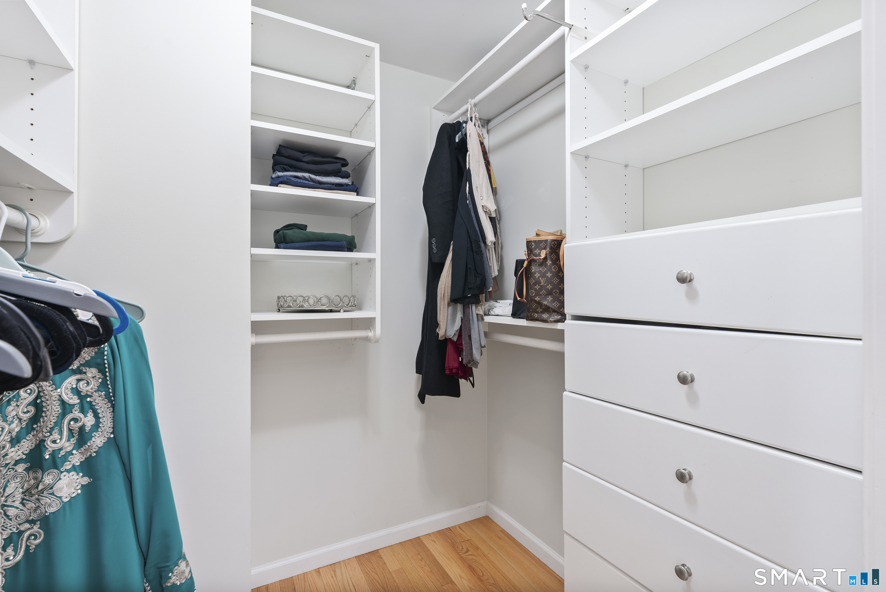 44 Farmstead Lane Suffield, CT 06078 - Photo 15 of 39 a view of walk in closet with clothes and shoes