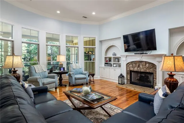 a bedroom with a bed and flat screen tv