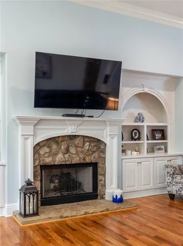 a bathroom with a tub shower and window