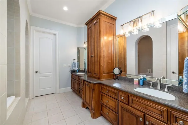 a bedroom with a bed and a night stand