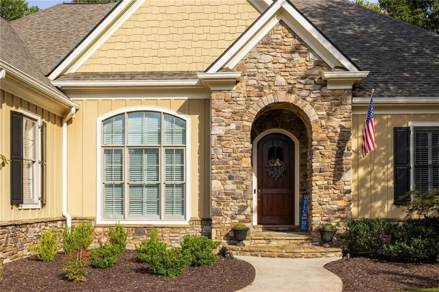 a kitchen with white cabinets and appliances