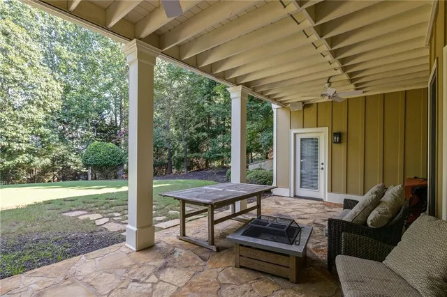 an aerial view of a house with a yard and lake view