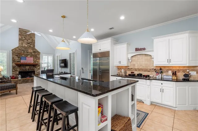 a living room with furniture fireplace and flat screen tv